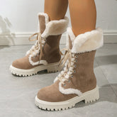 Beige suede winter boots with white faux fur lining and thick treaded soles