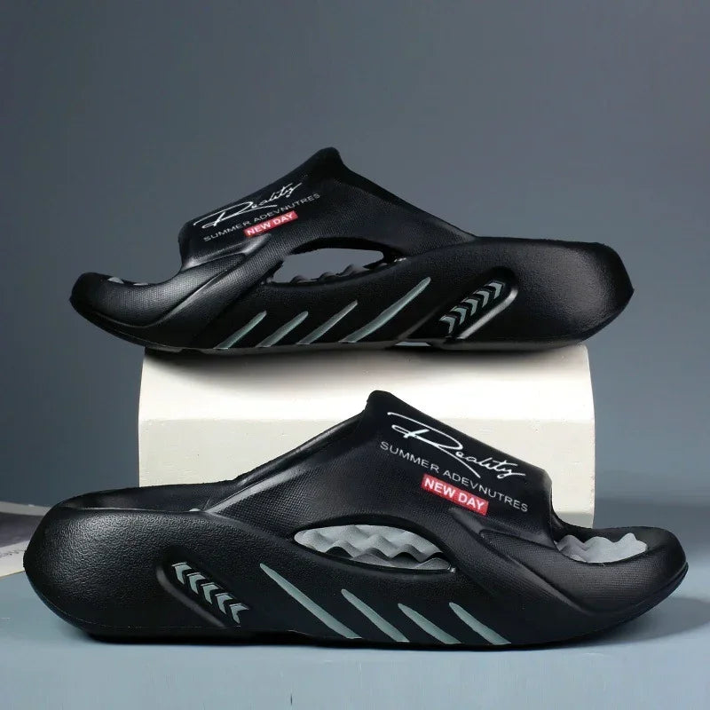 Black futuristic slip-on sandals with grey accents and cushioned sole, sporty streetwear style