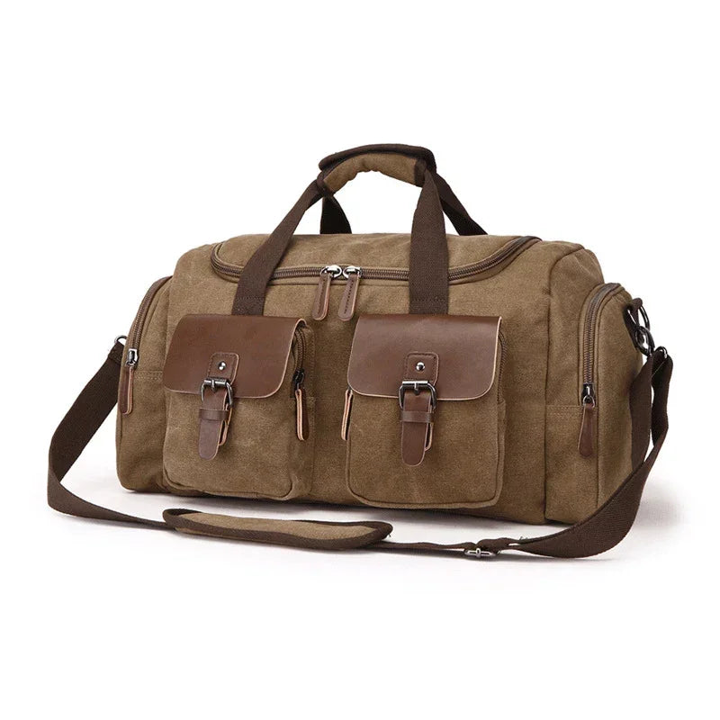 Brown canvas duffel bag with leather straps and buckle pockets, spacious travel style