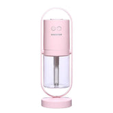 Minimalist pink portable humidifier with clear water tank and two control buttons