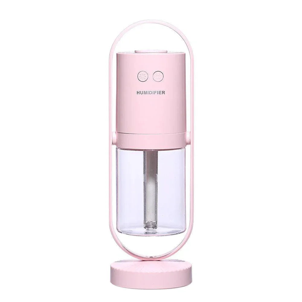 Minimalist pink portable humidifier with clear water tank and two control buttons