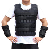 Man wearing black padded weighted vest and matching wrist weights over a white t-shirt