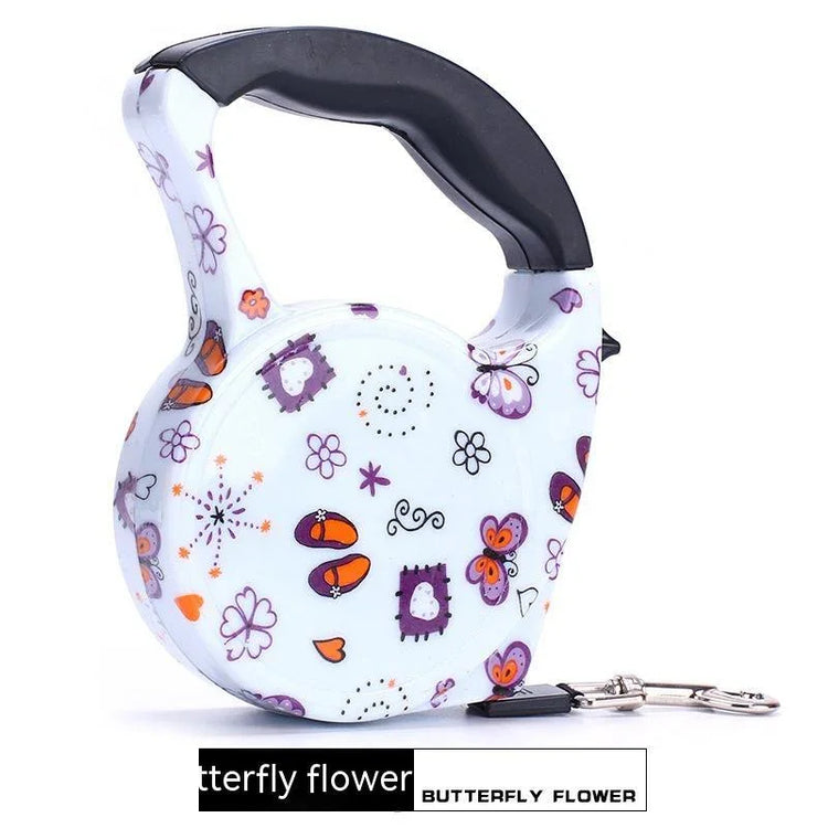 White retractable dog leash with colorful butterfly and flower pattern, ergonomic black handle