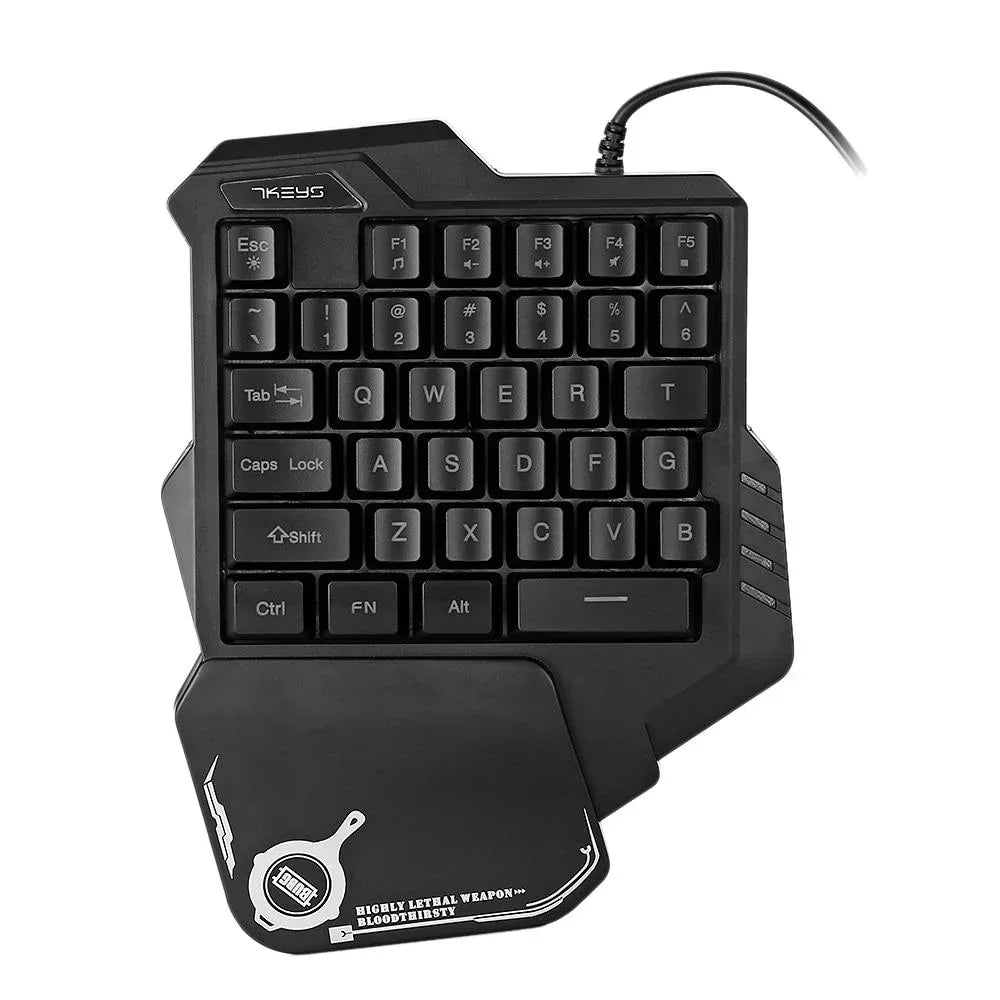Black one-handed mechanical gaming keypad with ergonomic wrist rest and compact keys.