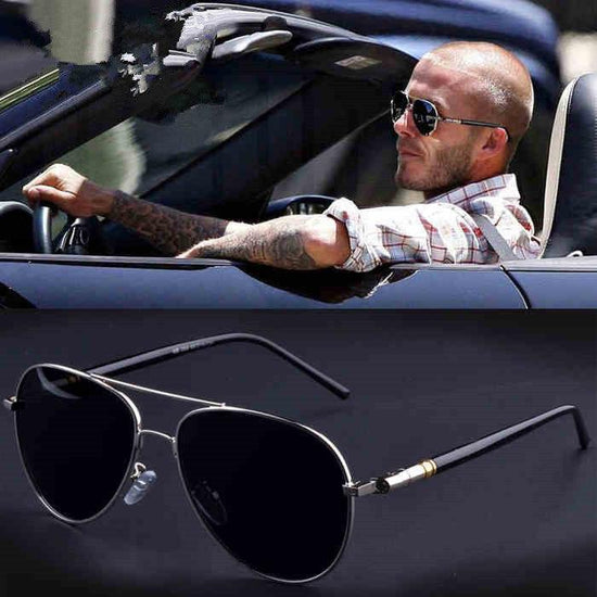 Man in casual plaid shirt driving convertible, wearing black aviator sunglasses; close-up of black metal aviator sunglasses below.