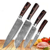 Set of four Damascus-style stainless steel chef knives with wood handles on a kitchen counter
