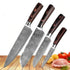 Set of four Damascus-style stainless steel chef knives with wood handles on a kitchen counter