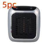 Compact portable electric heater with black mesh front and silver trim, top control buttons