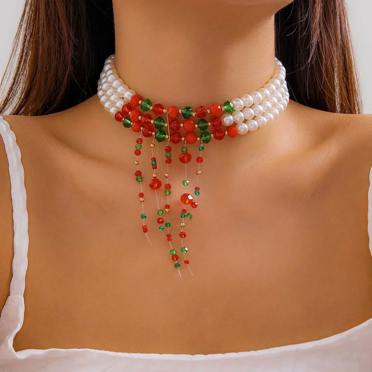 Layered pearl choker with red and green beaded accents and draped beaded strands, close fit