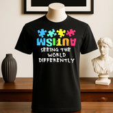Black cotton t-shirt with colorful puzzle graphic and bold slogan, relaxed fit, streetwear style