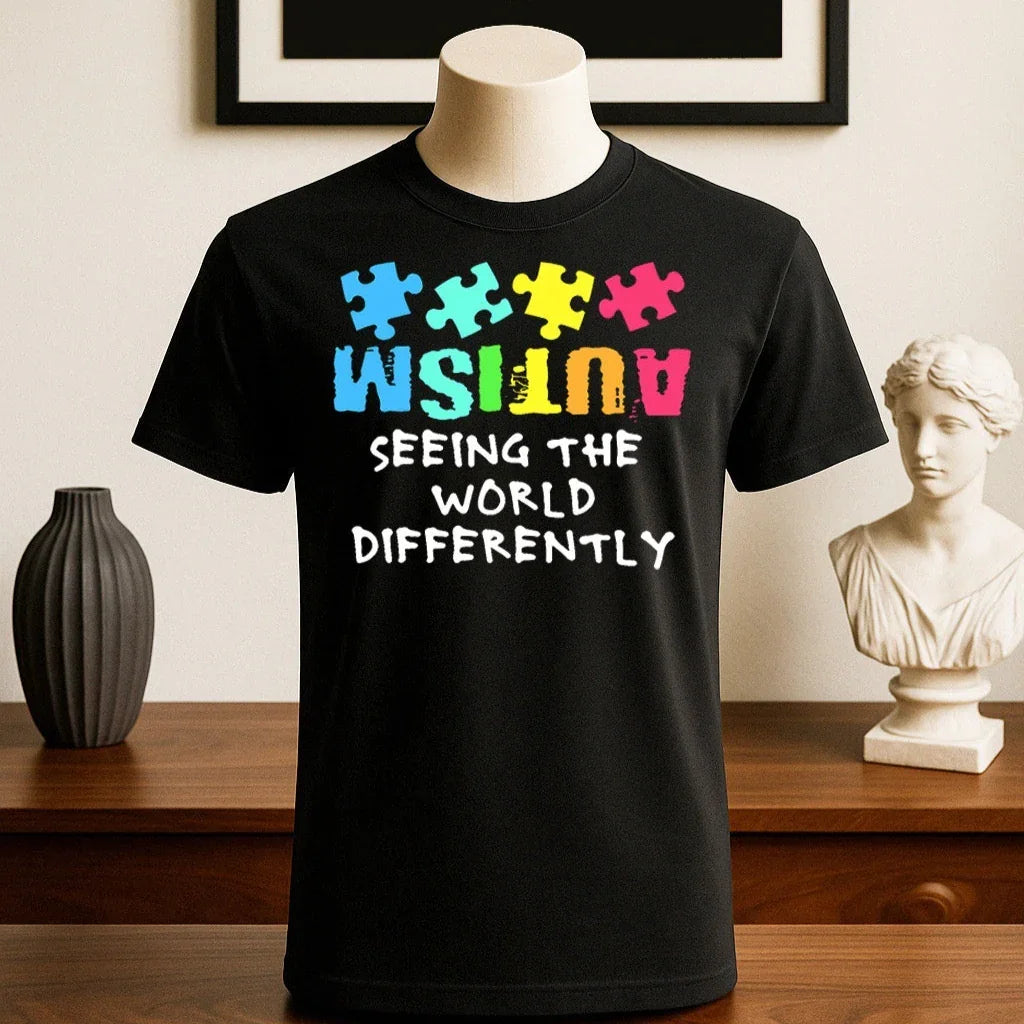 Black cotton t-shirt with colorful puzzle pieces and &