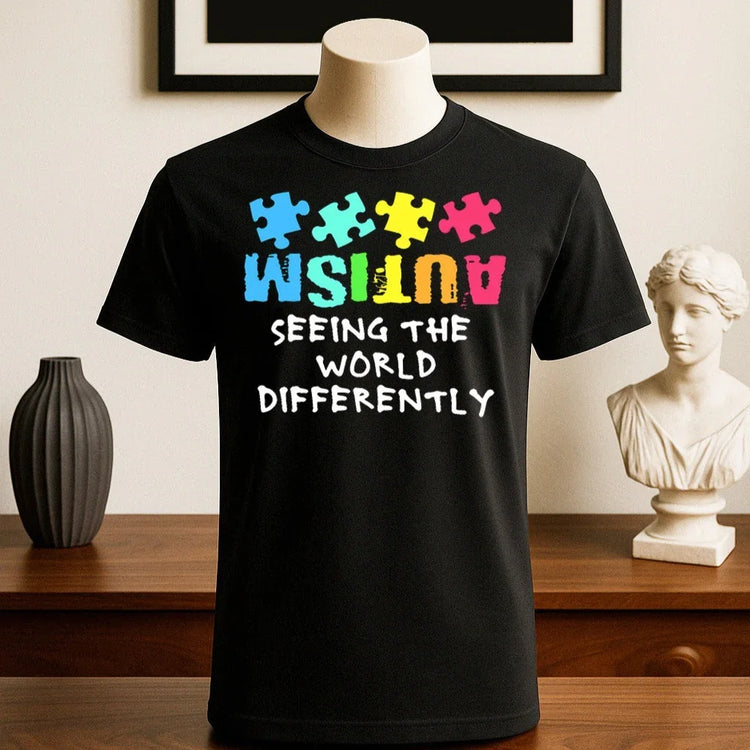 Black cotton t-shirt with colorful puzzle pieces and &