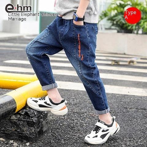 Casual blue denim jogger jeans with red accent, relaxed fit, rolled cuffs, street style.