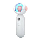 White handheld device with a cat figure in a transparent dome and a camera lens below