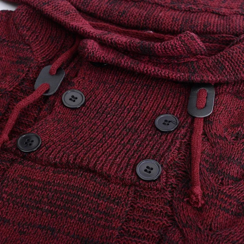 Close-up of chunky knit burgundy sweater with black buttons and drawstring details