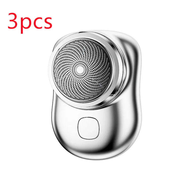 Silver compact electric shaver with sleek metallic finish and circular blade design