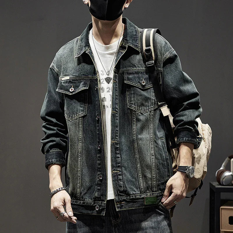 Men's oversized black denim jacket with vintage wash, chest pockets, casual streetwear style