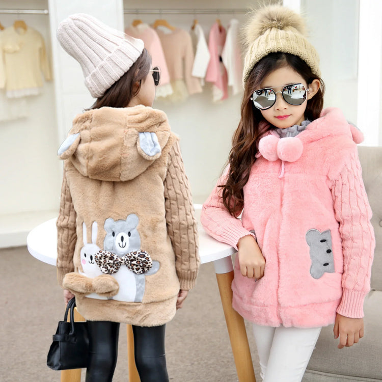 Girls in pink and tan plush faux fur hooded jackets with animal patches, cozy knit sleeves