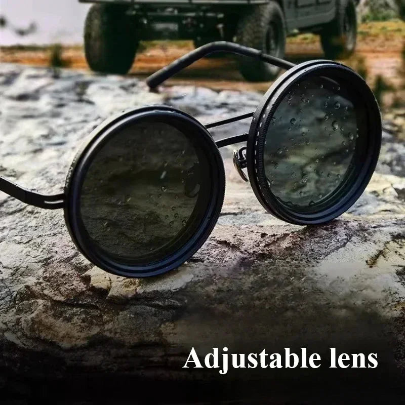 Round black adjustable lens sunglasses with metal frame, water-resistant, on outdoor rock