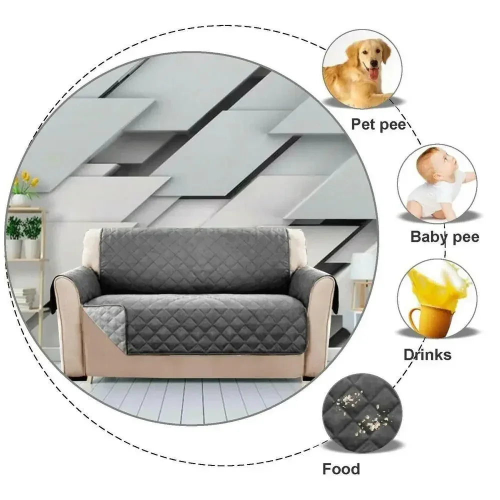 Gray quilted waterproof sofa cover protecting couch from spills, pet messes, and food stains.