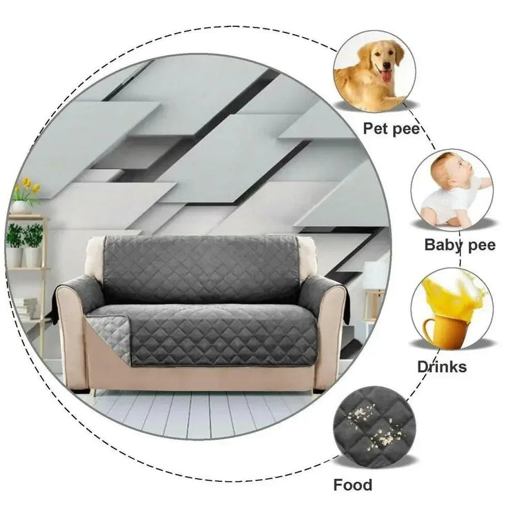 Gray quilted waterproof sofa cover protecting couch from spills, pet messes, and food stains.