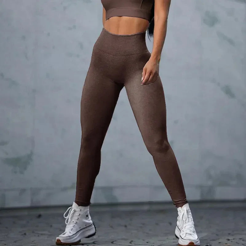 Woman wearing brown high-waisted seamless leggings and crop top, fitted athletic style