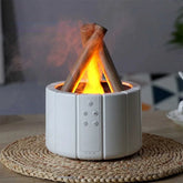 Modern white tabletop humidifier with faux campfire flame and control buttons, on woven mat