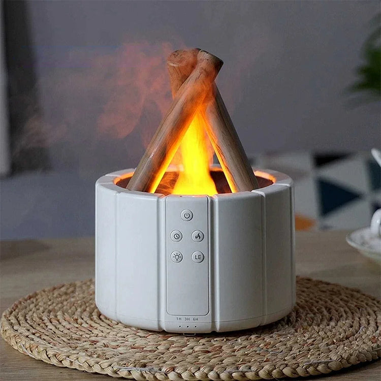 Modern white tabletop humidifier with faux campfire flame and control buttons, on woven mat