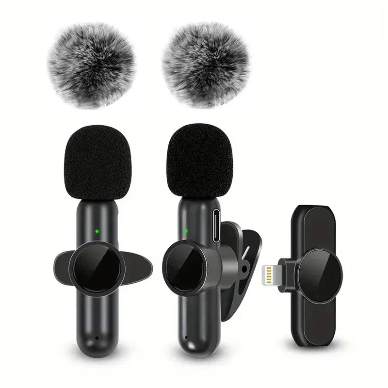 Black wireless clip-on microphones with foam windshields and furry wind covers
