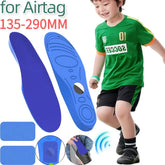Child in casual sportswear outfit with green athletic shirt and black shorts, blue foam insoles for shoes displayed; insoles designed for comfort and tracking device compatibility.