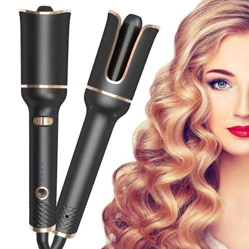 Black automatic hair curler with gold accents, creating loose voluminous curls on blonde hair