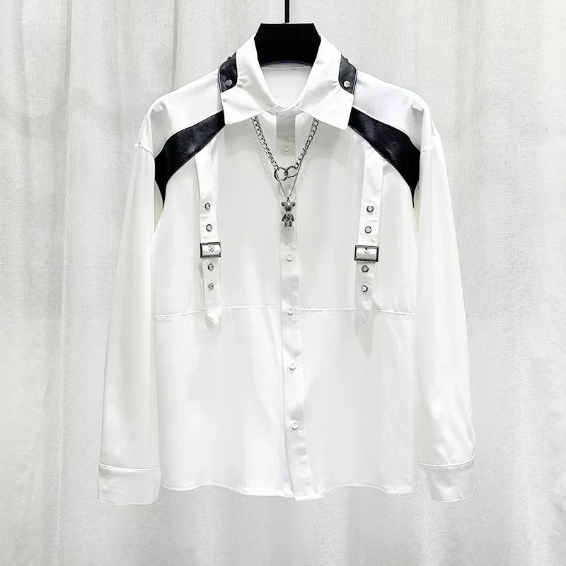 White long sleeve button-up shirt with black faux leather shoulder accents, metal buckle straps, and a relaxed fit.