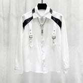 White long sleeve button-up shirt with black faux leather shoulder accents, metal buckle straps, and a relaxed fit.