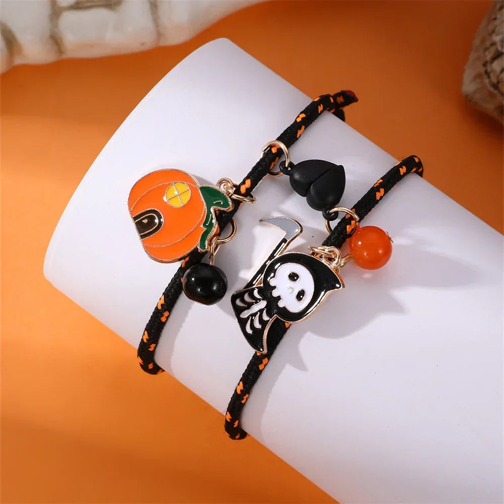 Black cord bracelets with Halloween pumpkin and skeleton charms, orange and black beads