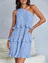 Light blue pleated one-shoulder mini dress with layered ruffle details, relaxed fit