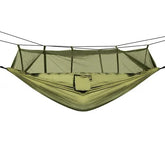 Olive green lightweight nylon hammock with built-in mesh canopy, ideal for outdoor camping.