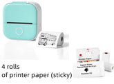 Compact mint green portable thermal printer with four rolls of sticky printer paper.