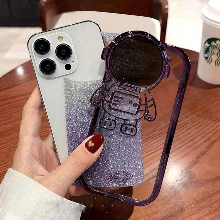 Glittery purple phone case with astronaut design, hard shell, fits snugly on smartphone