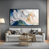 Modern living room with white leather sofa, abstract wall art, zebra print pillows, and neutral decor.