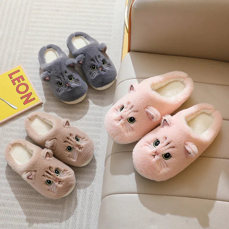 Plush cat face slippers in pink, beige, and grey, cozy indoor slip-on style, soft fleece material