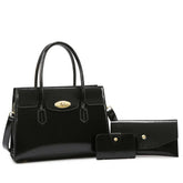 Glossy black faux leather handbag set with gold hardware, including wallet and cardholder.