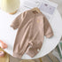 Beige ribbed baby jumpsuit with bear patch, long sleeves, snap buttons, relaxed fit