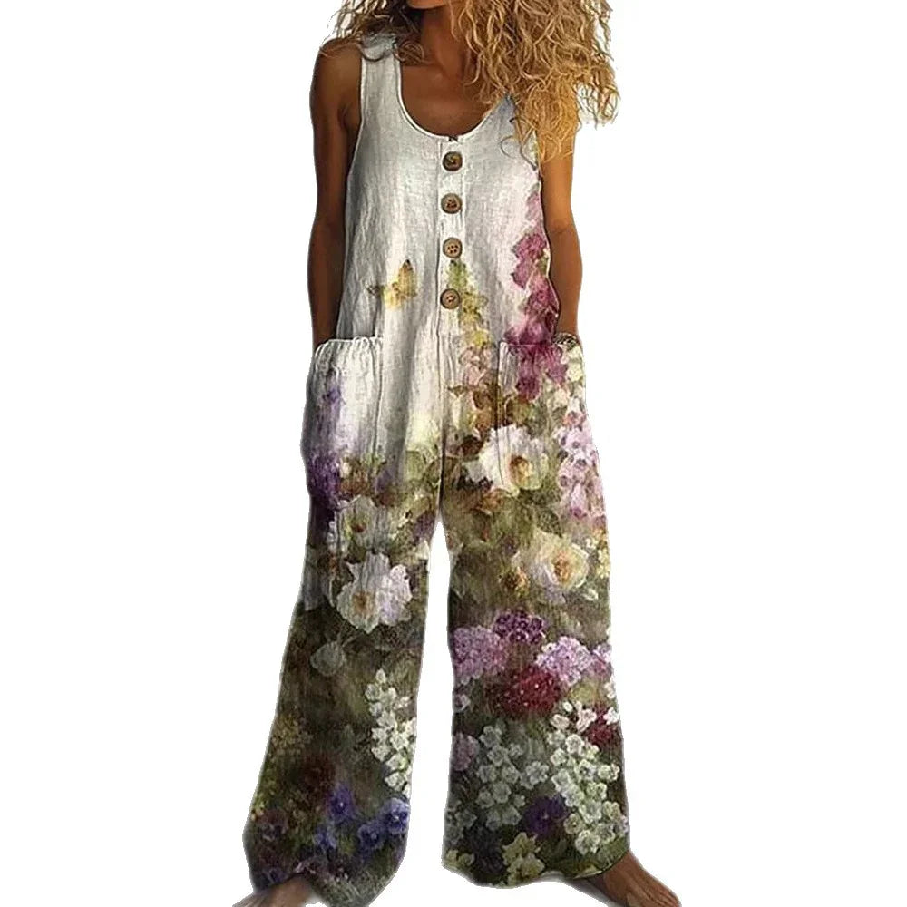 Sleeveless linen jumpsuit with wide legs, wooden buttons, and a colorful floral print.