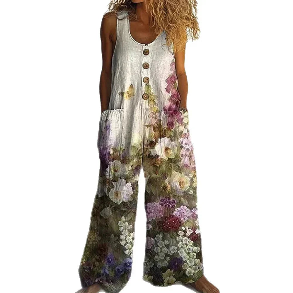 Sleeveless linen jumpsuit with wide legs, wooden buttons, and a colorful floral print.
