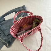 Red and white checkered tote bag with sturdy handles, cotton material, casual style