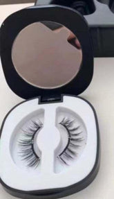 Natural-looking false eyelashes in a black compact case with mirror, lightweight synthetic material