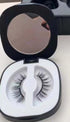Natural-looking false eyelashes in a black compact case with mirror, lightweight synthetic material