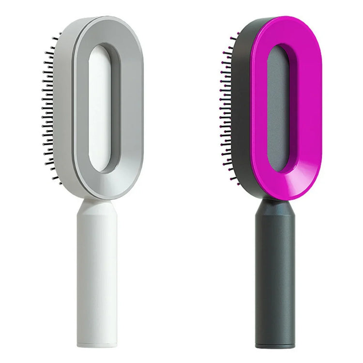 Two modern oval hairbrushes with ergonomic handles, one gray and one black with pink accent.