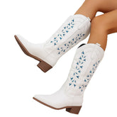 White western cowboy boots with blue embroidery, block heel, and mid-calf fit