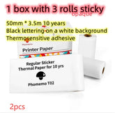 Three rolls of white thermal printer paper, black text, standard sticker adhesive.